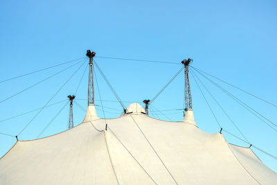 Low angle view of cables against clear blue sky