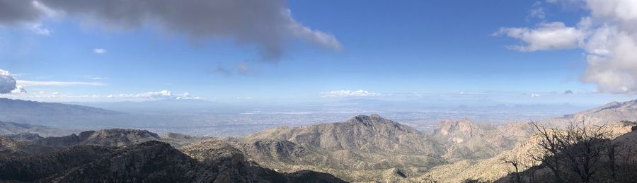 Panoramic view of landscape against cloudy sky