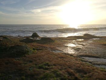 Scenic view of sea against sky during sunset