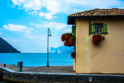 House by sea against sky