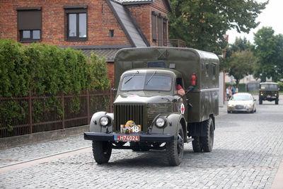 Vintage car on street against building