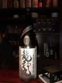 Wine bottles on table at restaurant