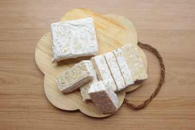 High angle view of bread on cutting board