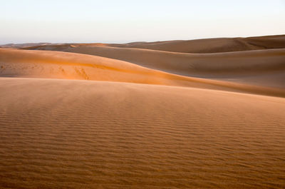 Scenic view of desert against clear sky