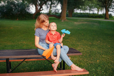 Boy sitting in park