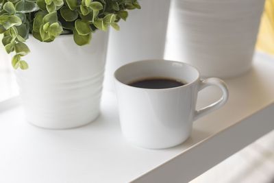 Close-up of black coffee in cup on table