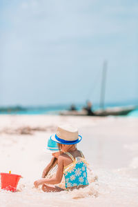 Man relaxing on sand at beach