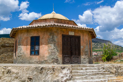 Exterior of historic building against sky