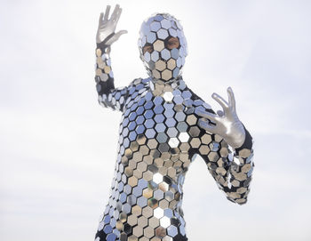 Low angle view of statue against sky