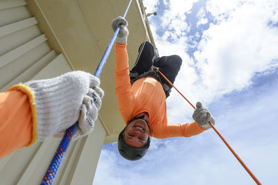 A man rappelling down the lacerda elevator. city of salvador, bahia, brazil.