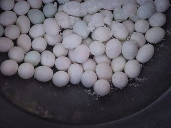 High angle view of stones in container