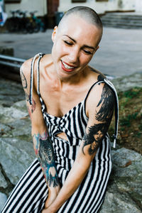 Smiling young woman standing outdoors