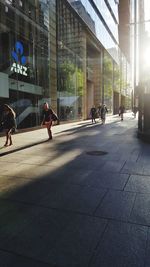 People walking on street in city