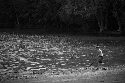 Little boy at the lake in black and white