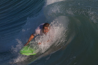 High angle view of man swimming in sea