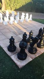 High angle view of chess pieces on table in park