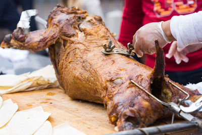 Close-up of hand holding meat