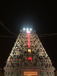 Low angle view of illuminated statue at night