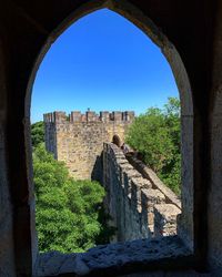 Old ruin building against blue sky