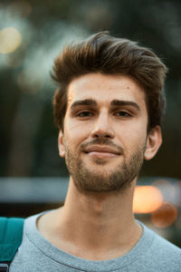 Close-up portrait of smiling young man