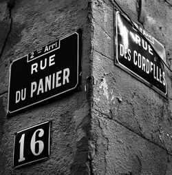 Close-up of information sign on wall