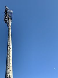 Low angle view of eiffel tower against clear blue sky