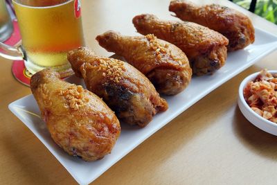 Close-up of deep fried chickens served in plate on table