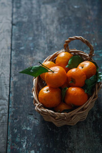 Close-up of fruits in basket on table