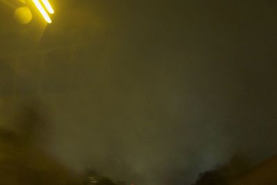 Low angle view of illuminated sky at night