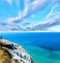 Scenic view of sea against blue sky