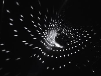 Low angle view of illuminated ferris wheel