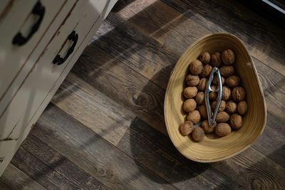 High angle view of nuts and cracker in bowl