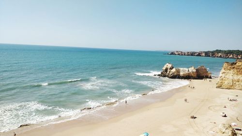 Scenic view of beach against clear sky