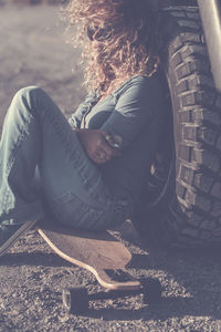 High angle view of woman sitting in city