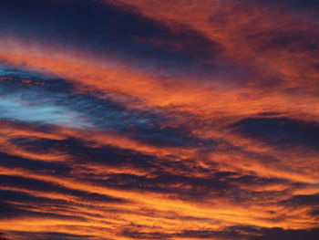 Low angle view of dramatic sky during sunset