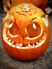 Close-up of pumpkin on wood during autumn