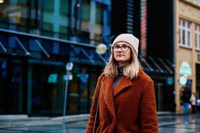 Woman walking at city street