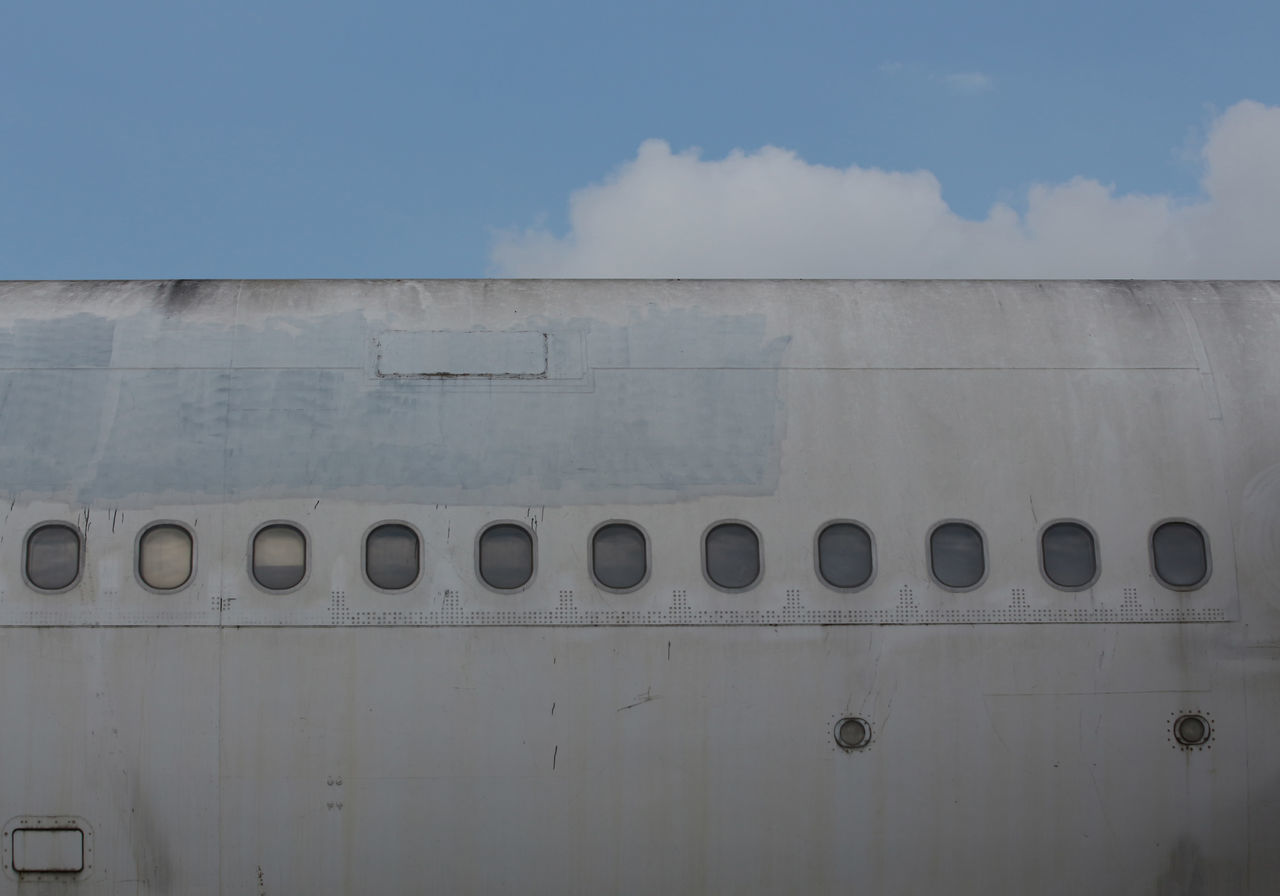 sky, airplane, air vehicle, transportation, cloud, no people, mode of transportation, day, vehicle, wall, aviation, nature, architecture, outdoors, aircraft, airport, travel