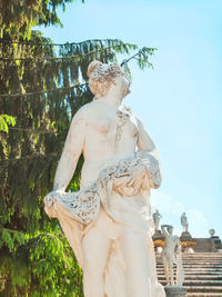 Low angle view of statue against sky