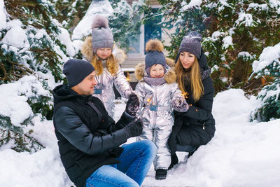 Group of people in traditional clothing during winter