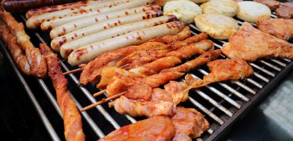 High angle view of meat on barbecue grill