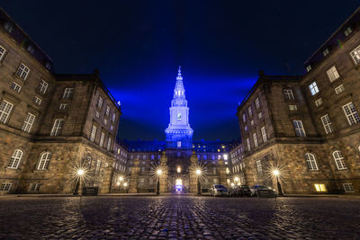 Low angle view of illuminated buildings at night