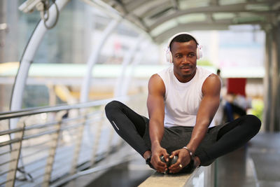 Portrait of young man sitting outdoors