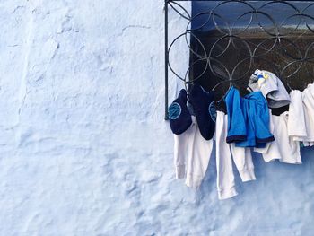 Clothes drying against blue sky