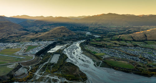 High angle view of town during sunset