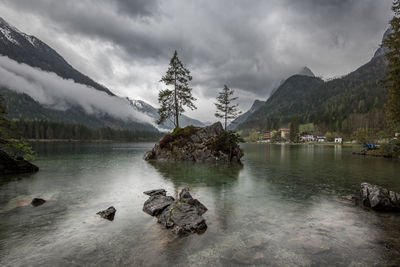 Scenic view of lake against cloudy sky