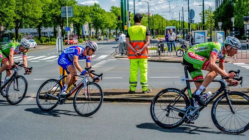 People riding bicycle on road