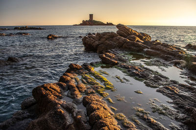 Scenic view of sea against sky during sunset