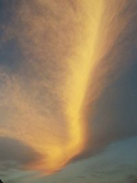 Low angle view of cloudy sky at sunset