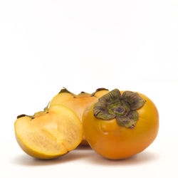 Close-up of fruits against white background